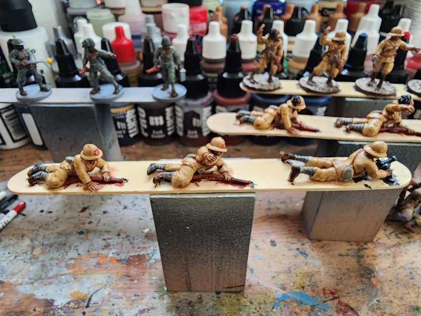 Figures in the process of being painted